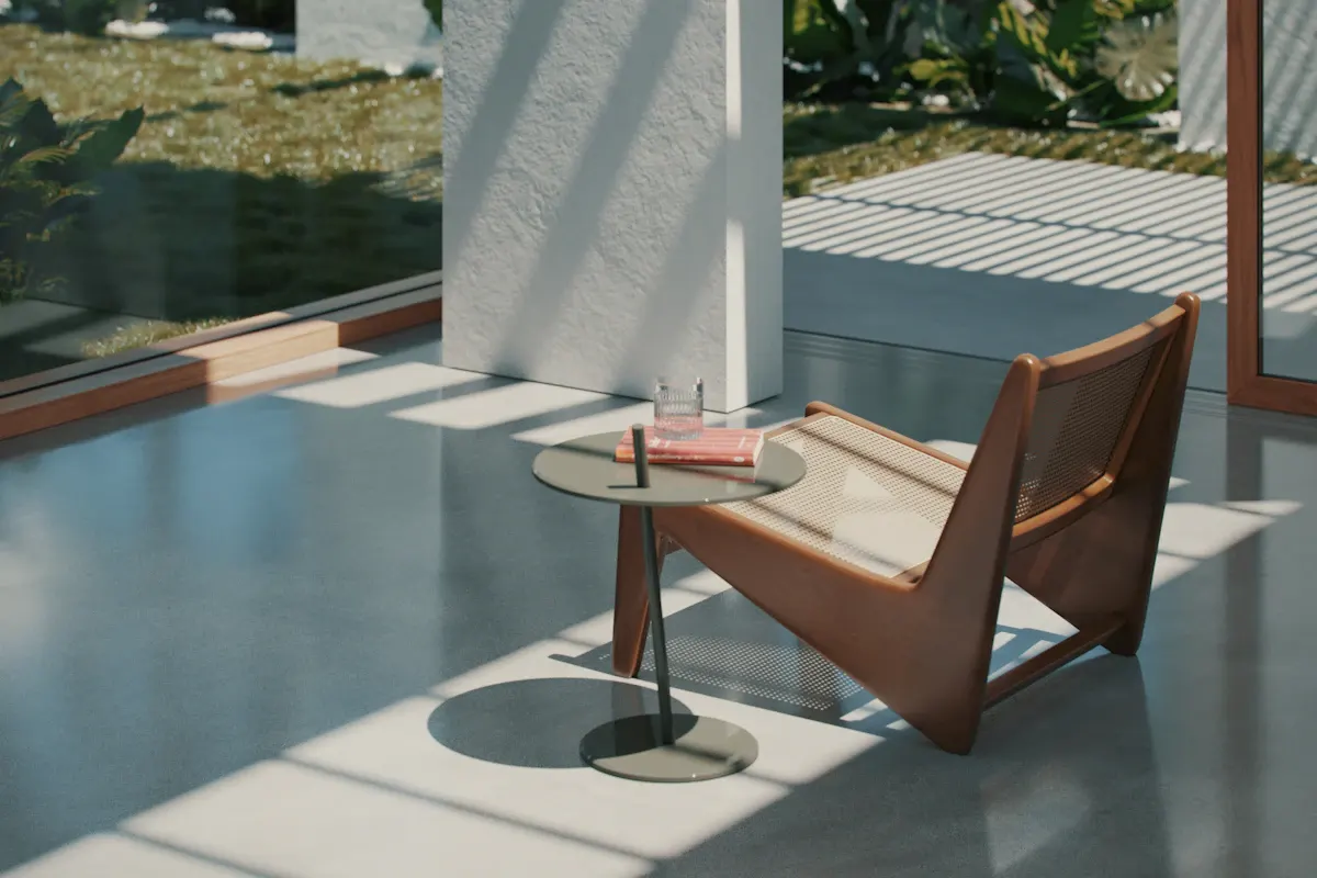Smooth grey floor beside a chair and full-height glazing