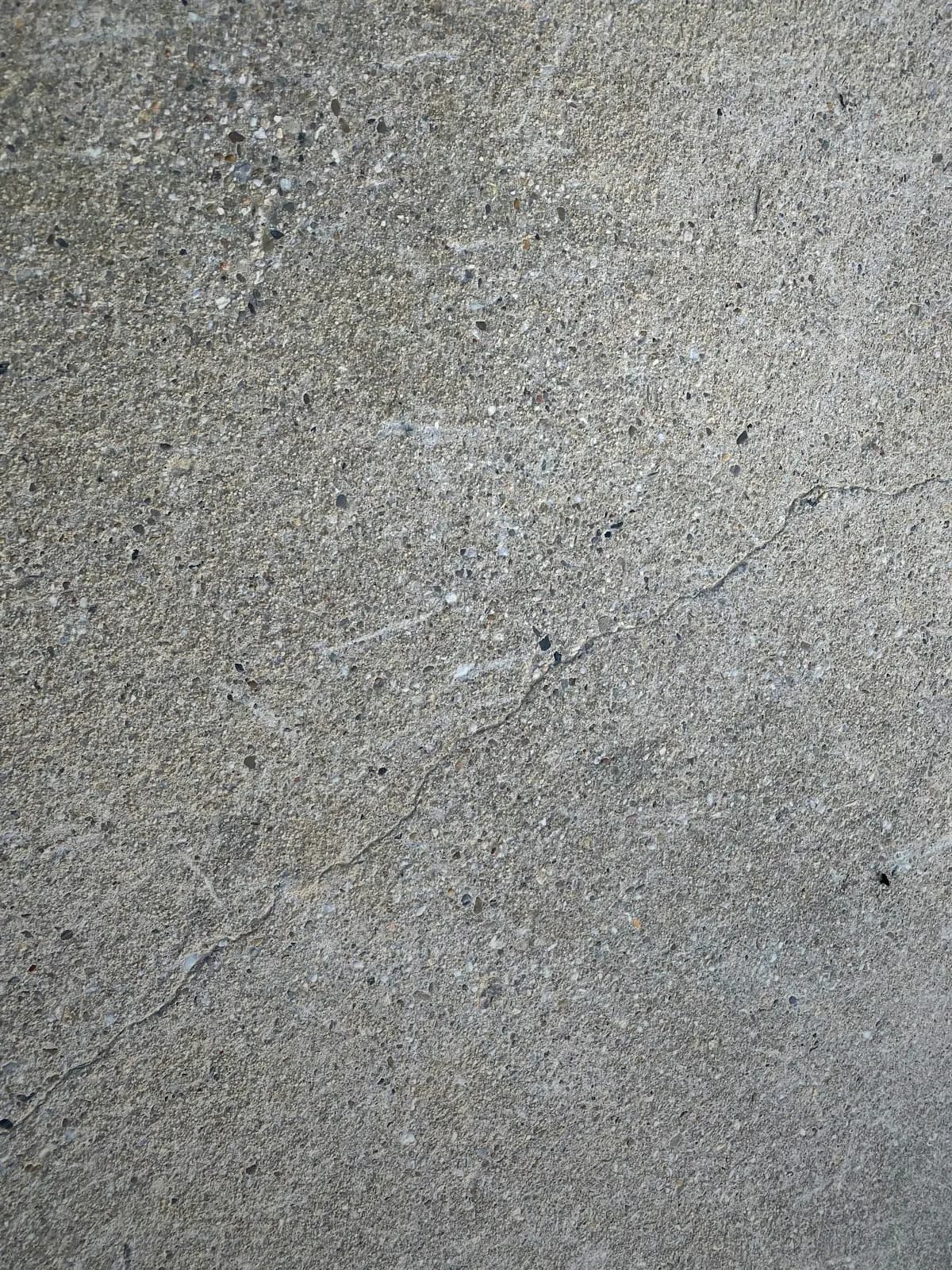 Close view of fine aggregate in grey concrete